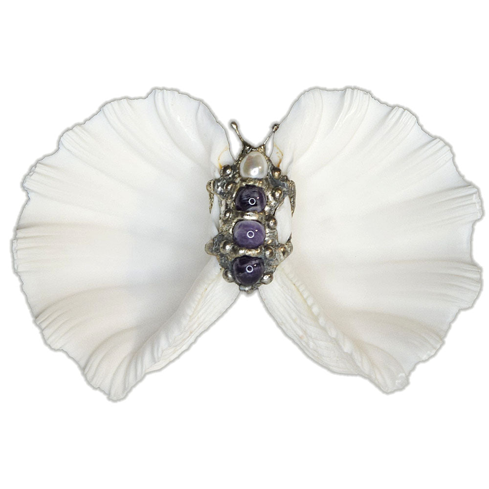 Two bear claw clam shells have been set together to form this shell bowl adorned with three large amethyst balls and a large white pearl. Comes with a leucite stand. Dress up any table for special occasions.