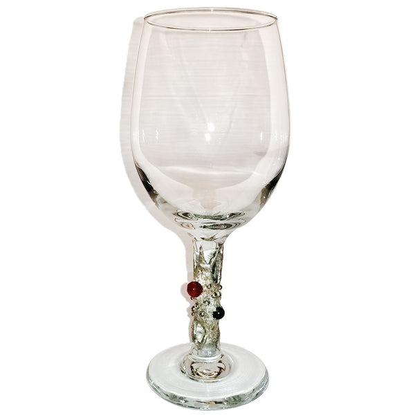 white wine glass with pearls, ruby and emerald. Back view