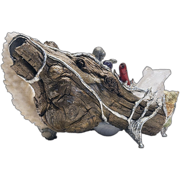 A mermaid rests on a large pink abalone shell, adorned with corals, seashells, gemstones and driftwood back view