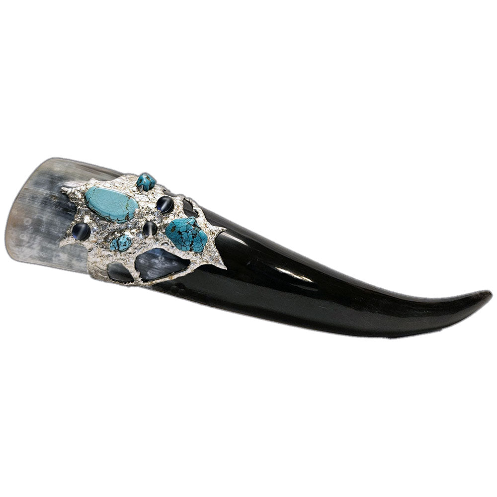 a drinking horn made from steer, turquoise cabochon, a large turquoise nugget and two small turquoise nuggets and three mermaid tears