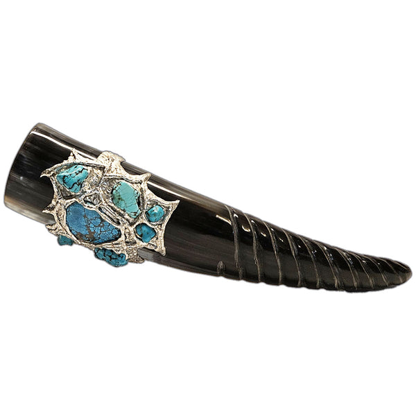 a drinking horn made from steer with a spiral carving at the bottom, two turquoise cabochons, two turquoise nugget and three small turquoise nuggets and three mermaid tears side view 2