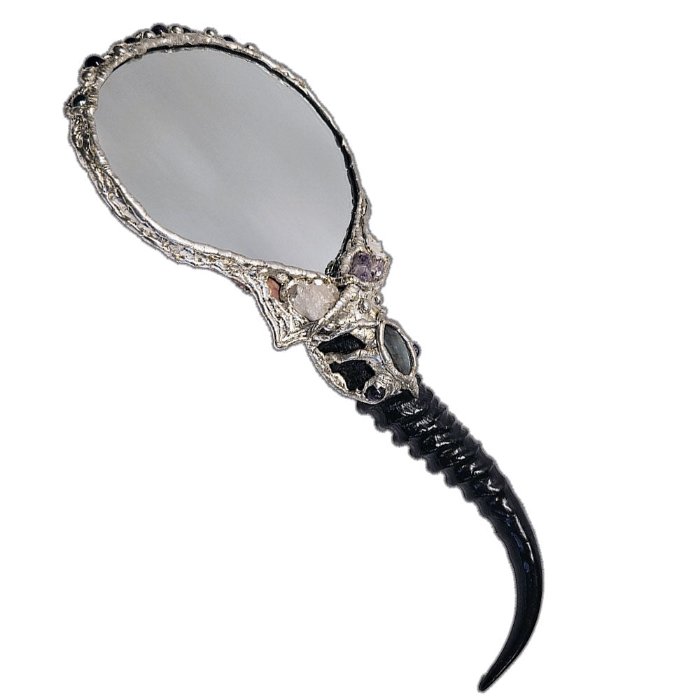 Decorative hand mirror with a blesbok horn handle, labradorite, quartz, amethyst, black pearls and red branch coral
