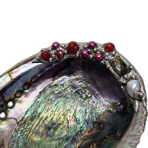 abalone shell with rubies and labradorite close up