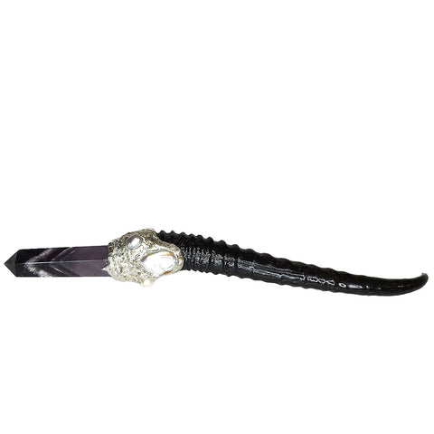 A dark amethyst point with white chevrons inclusions is set on a springbok horn handle. A large white pearl, small white pearl and a small silver pearl adorn the rest. Front view.