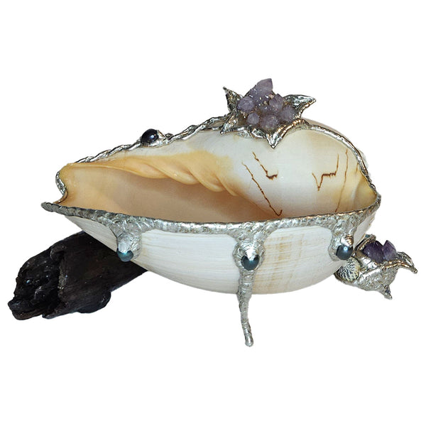 Melon shell on driftwood with amethyst. black pearls and turquoise. Front view.