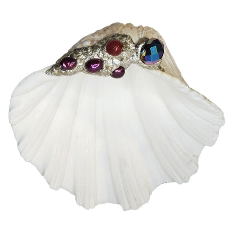 A beautiful china clam shell bowl is decorated with a large titaniumized faceted crystal bead, a ruby crystal faceted ball and three purple pearls. Comes with a leucite stand.