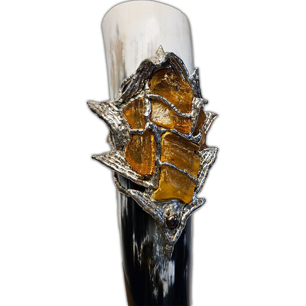 rough amber decorated drinking horn close up