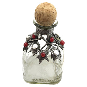 A Patron bottle is decorated with six small ruby and one large ruby crystal faceted beads. Four large coin pearls and a large white freshwater white pearl. Hold your favorite spirits and taste the difference. 
