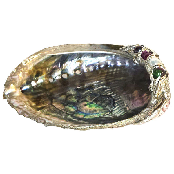 Ruby zoisite is adorned with a small black pearl, small purple pearl and a small white pearl all on a lovely small green abalone. Comes with leucite stand.