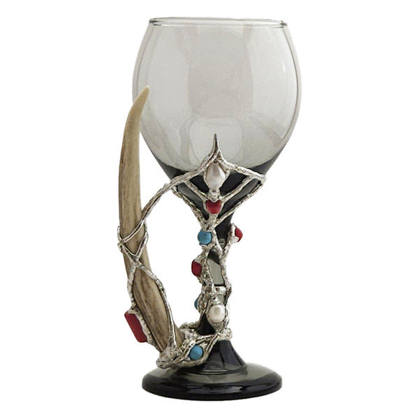 Wrapped around a 13.5 oz smoky red wine glass with a deer antler. You will find four red coral beads and a red branch coral that is set on the deer antler. Three turquoise balls and two small white pearls add just the right accent to this exclusive one and only wine glass. Back view