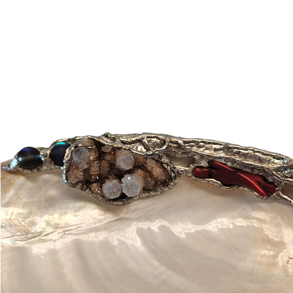 River clam shell jewelry dish with amethyst, labradorite, red branch coral and mermaid tears left view