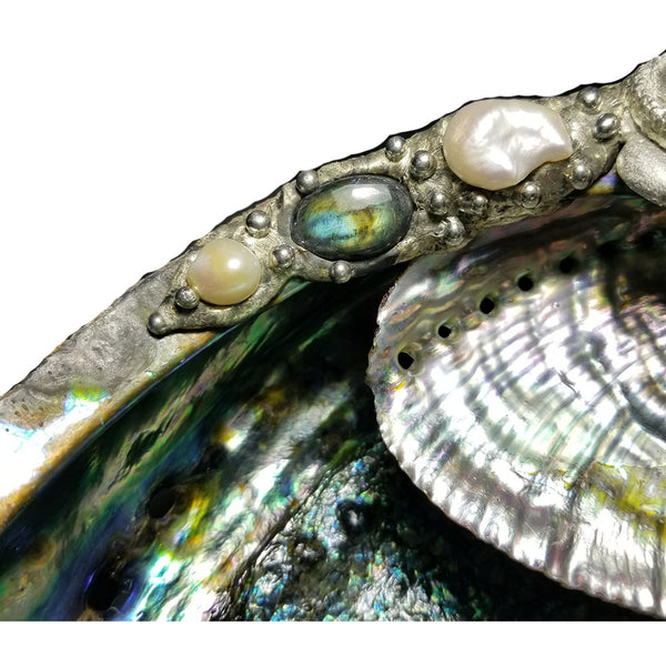 Close up of labradorite cabochon on mermaid abalone jewelry bowl